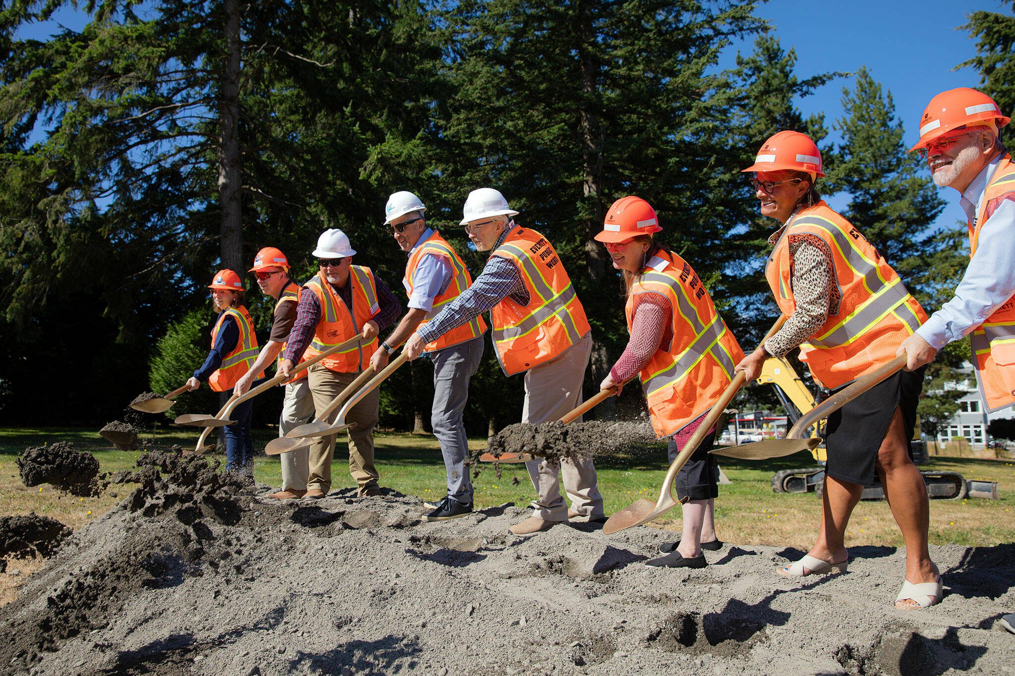Officials toss some dirt with their golden shovels at the conclusion of a groundbreaking ceremony for the Reservoir 3 Replacement Project on Tuesday, July 23, 2024, in Everett, Washington. (Ryan Berry / The Herald)