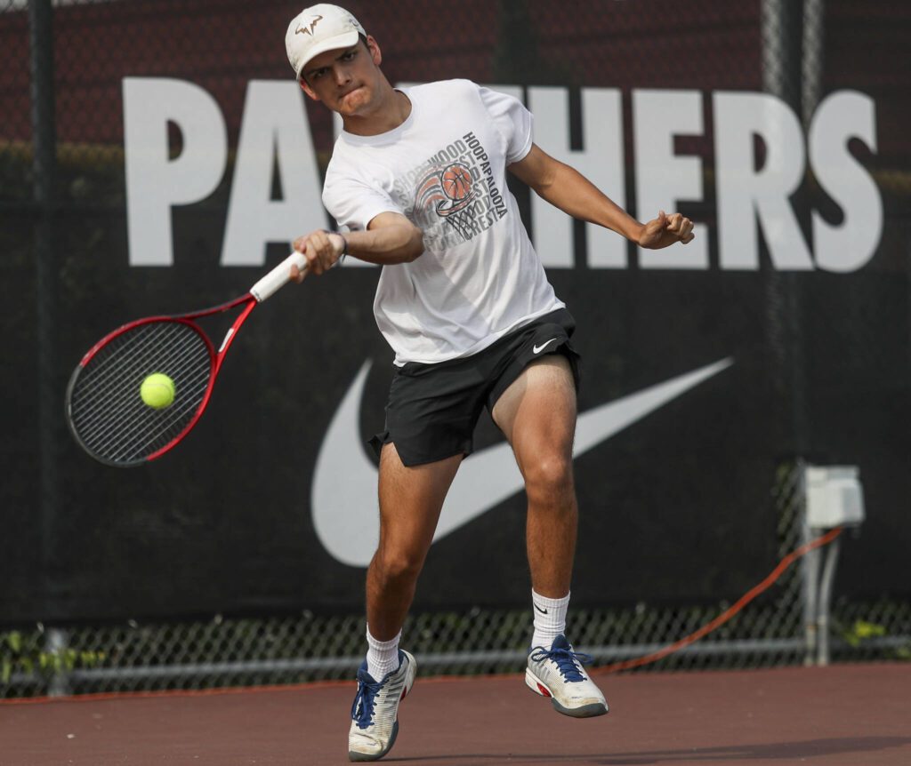 Shorewood’s Eli Sheffield hits the ball during the boys doubles championship match at Snohomish Summer Smash at Snohomish High School in Snohomish, Washington on Sunday, July 21, 2024. (Annie Barker / The Herald)

