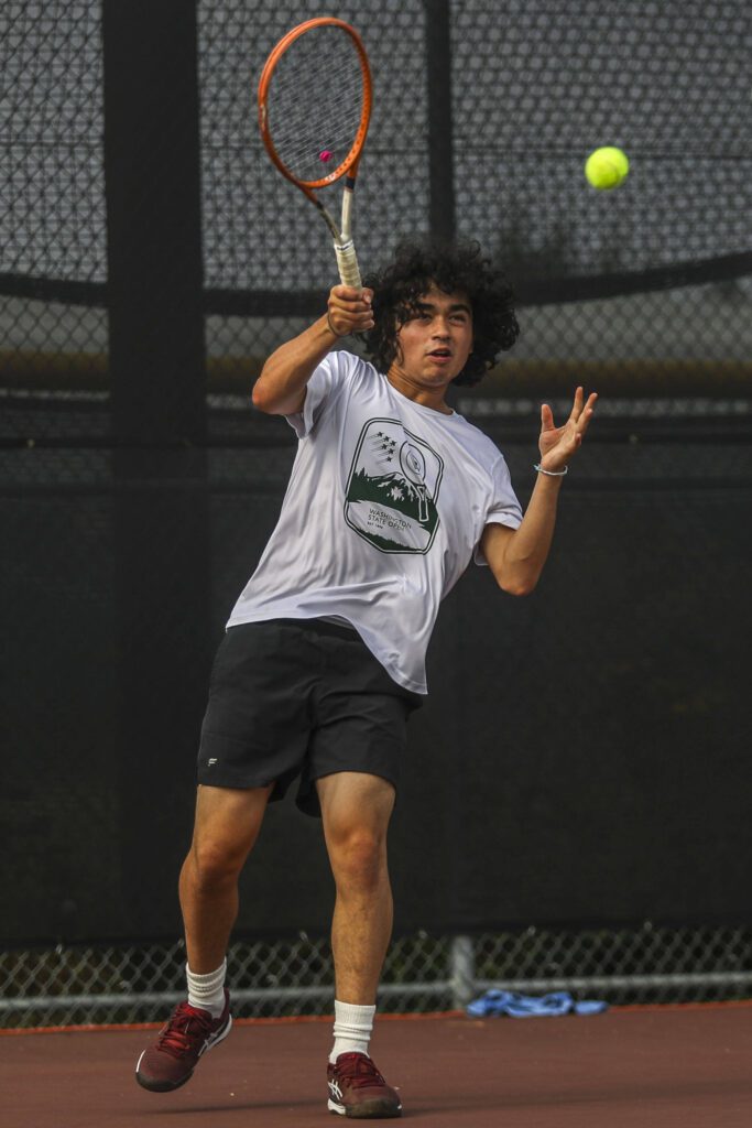 Edmonds-Woodway’s Nalu Akiona hits the ball during the boys doubles championship match at Snohomish Summer Smash at Snohomish High School in Snohomish, Washington on Sunday, July 21, 2024. (Annie Barker / The Herald)
