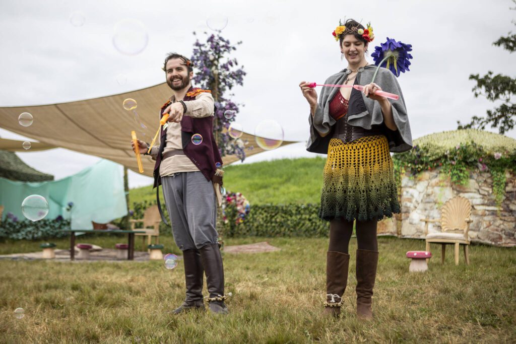 Festival workers blow bubbles during the Washington Midsummer Renaissance Faire near Monroe on Sunday. (Annie Barker / The Herald)
