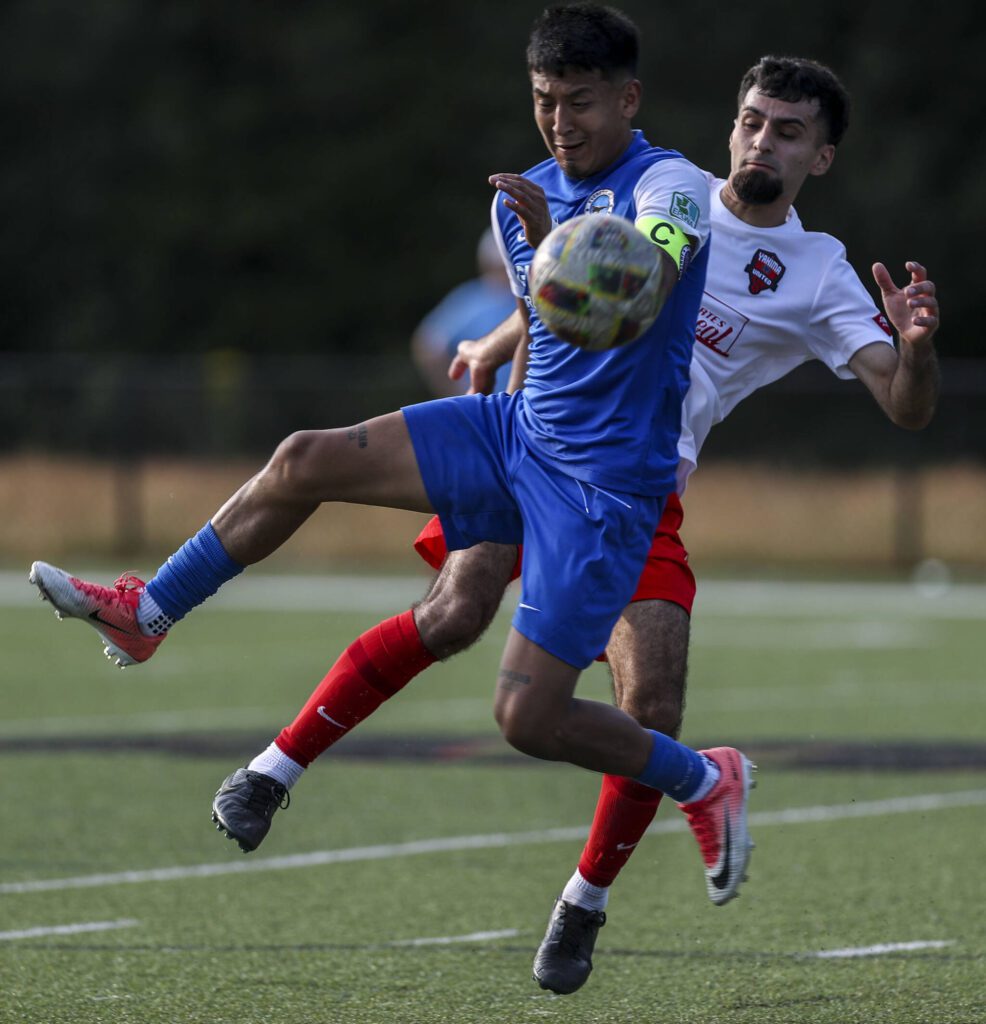 Players fight for the ball during the EPLWA championships between semi-pro men’s soccer team Everett Jets FC and Yakima United at Archbishop Murphy High School in Everett, Washington on Saturday, July 27, 2024. Yakima won, 6-1. (Annie Barker / The Herald)
