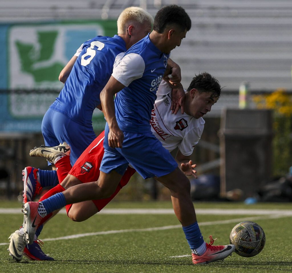 Everett’s Kaydin Wall (6) and Manuel Segura (10) fight for the ball during the EPLWA championships between semi-pro men’s soccer team Everett Jets FC and Yakima United at Archbishop Murphy High School in Everett, Washington on Saturday, July 27, 2024. Yakima won, 6-1. (Annie Barker / The Herald)
