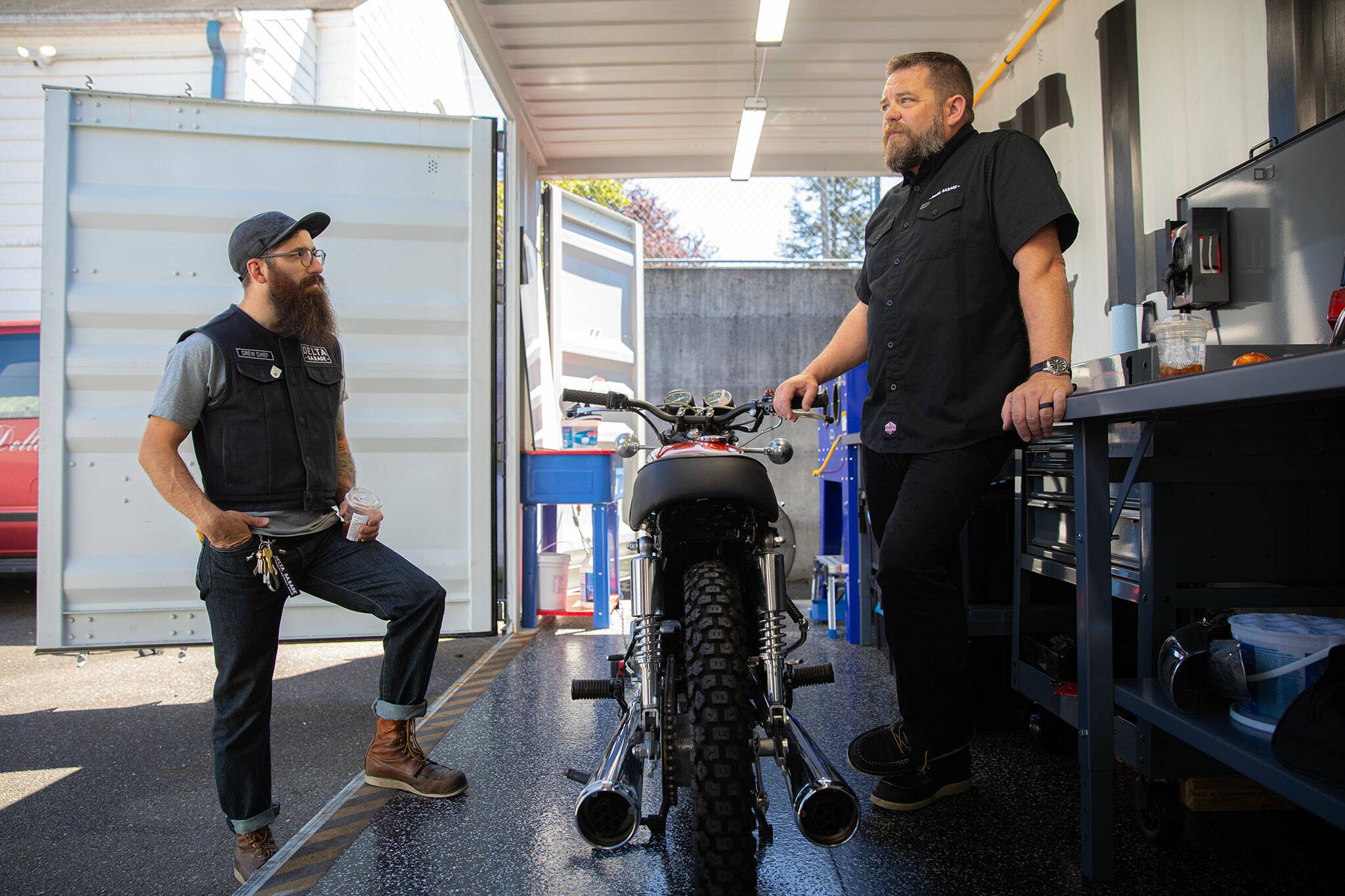 Delta Garage founders Jared Kalinski, left, and Luke Emerson stand inside the workspace at Delta Garage during an interview on July 5 in Everett.