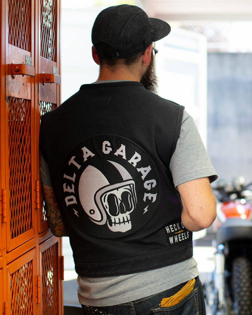 Jared Kalinski wears his Delta Garage vest during an interview at Delta Garage on Friday, July 5, 2024, in Everett, Washington. (Ryan Berry / The Herald)
