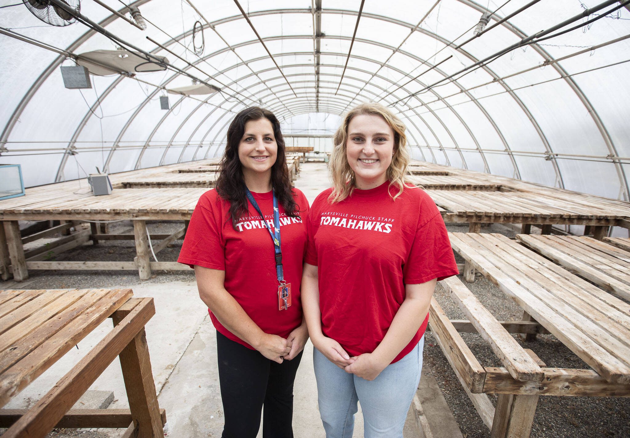 Marysville Pilchuck teachers Kayla Carter, left, and Claire Luvera, right, inside the decluttered greenhouse at Marysville Pilchuck High School on Monday in Marysville. (Olivia Vanni / The Herald)