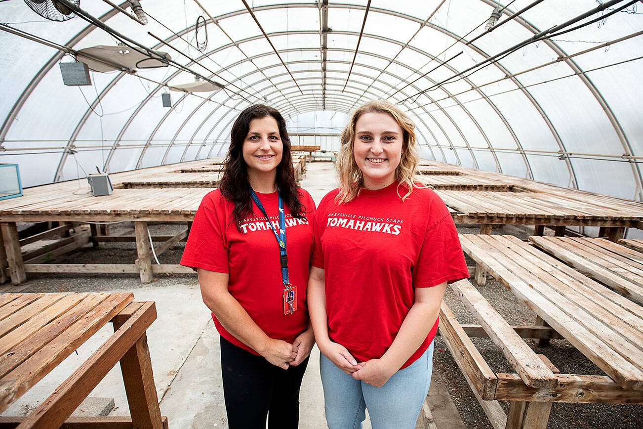 Marysville Pilchuck teachers Kayla Carter, left, and Claire Luvera, right, inside the decluttered greenhouse at Marysville Pilchuck High School on Monday, July 29, 2024 in Marysville, Washington. (Olivia Vanni / The Herald)