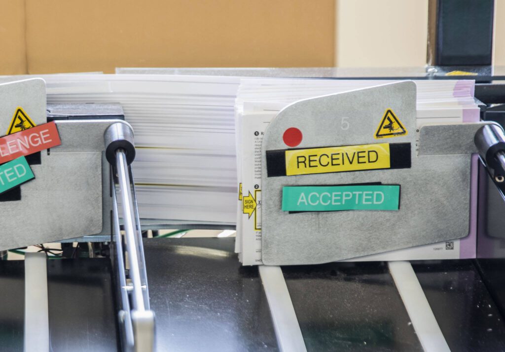 Ballots are sorted through a machine at the elections center on Monday, Aug. 5, 2024, in Everett, Washington. (Olivia Vanni / The Herald)
