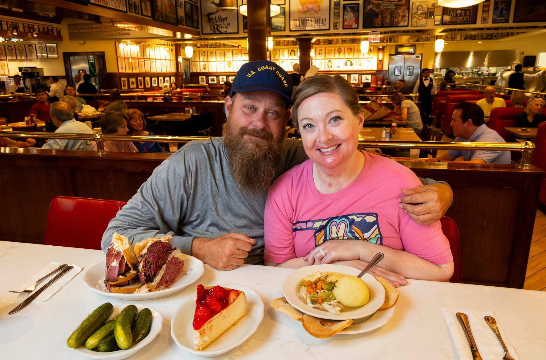Nathan and Kim Maker, scuba divers who had been lost in the Gulf of Mexico for nearly two days, at Kenny & Ziggy’s Delicatessen Restaurant & Bakery on Monday in Houston. The pair of scuba divers were dramatically rescued from the Gulf of Mexico — they knew their first stop after the ordeal would be Kenny & Ziggy’s. (Annie Mulligan / © 2024 The New York Times Company)