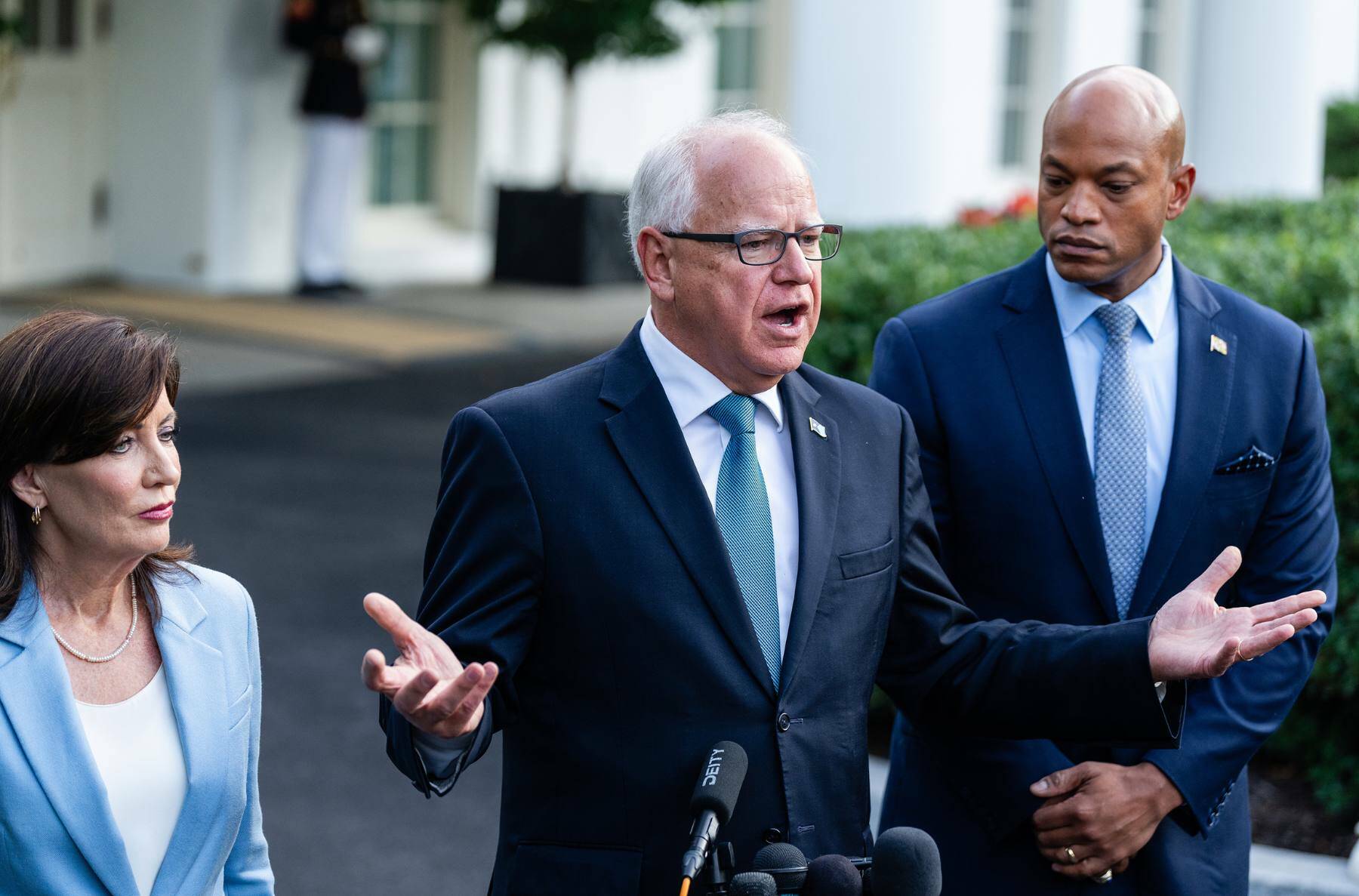 Minnesota Gov. Tim Walz speaks to reporters after meeting with President Joe Biden, at the White House in Washington, on July 3. As governor, Walz has enacted policies to secure abortion protections, provide free meals for schoolchildren, allow recreational marijuana and set renewable energy goals. (Eric Lee/The New York Times)