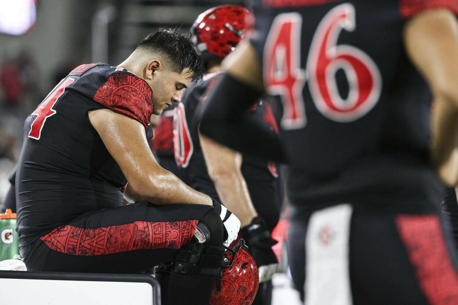 Offensive lineman Drew Azzopardi (left), a recent transfer to the University of Washington, reacts on the sideline in San Diego State’s loss to Nevada on Saturday, Oct. 21, 2023. (Meg McLaughlin / The San Diego Union-Tribune).
