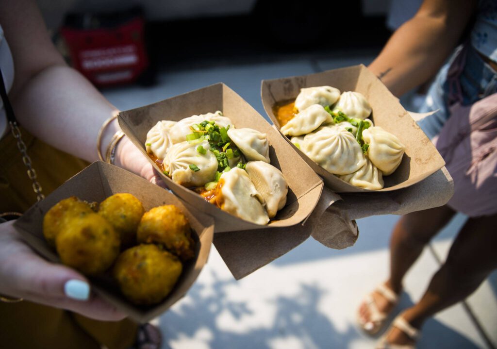 Dumplings and cheese balls at Taste Edmonds on Friday in Edmonds. (Olivia Vanni / The Herald)
