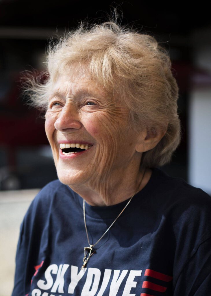 Kim Knor laughs as she waits to gear up for her 730th skydive at Skydive Snohomish on Wednesday, Aug. 14, 2024 in Snohomish, Washington. (Olivia Vanni / The Herald)
