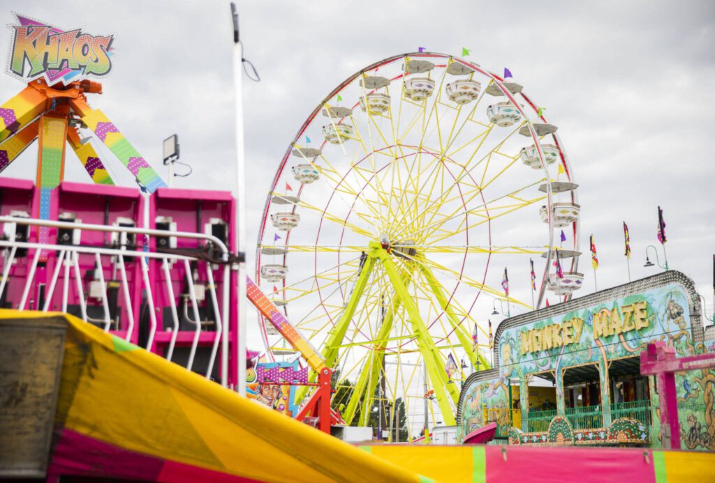 Colorful rides are put together before the start of the Evergreen State Fair on Wednesday, Aug. 21, 2024, in Monroe, Washington. (Olivia Vanni / The Herald)
