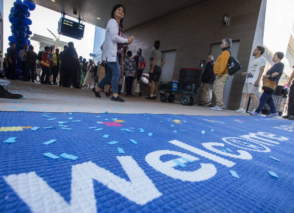 Members of the public line up to ride the first trains during the Lynnwood 1 Line extension opening celebrations on Friday, Aug. 30, 2024 in Lynnwood, Washington. (Olivia Vanni / The Herald)
