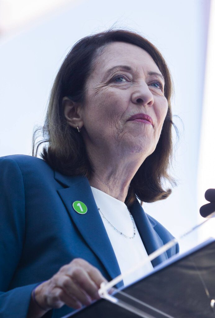 Sen. Maria Cantwell wears a 1 Line pin while speaking during the Lynnwood 1 Line extension opening celebrations on Friday, Aug. 30, 2024 in Lynnwood, Washington. (Olivia Vanni / The Herald)
