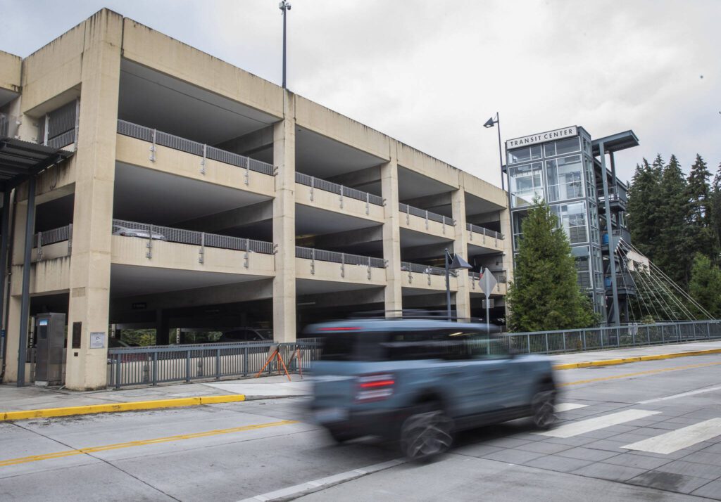 A car drives past the Mountlake Terrace Transit Center parking garage on Tuesday, Aug. 20, 2024 in Mountlake Terrace, Washington. (Olivia Vanni / The Herald)
