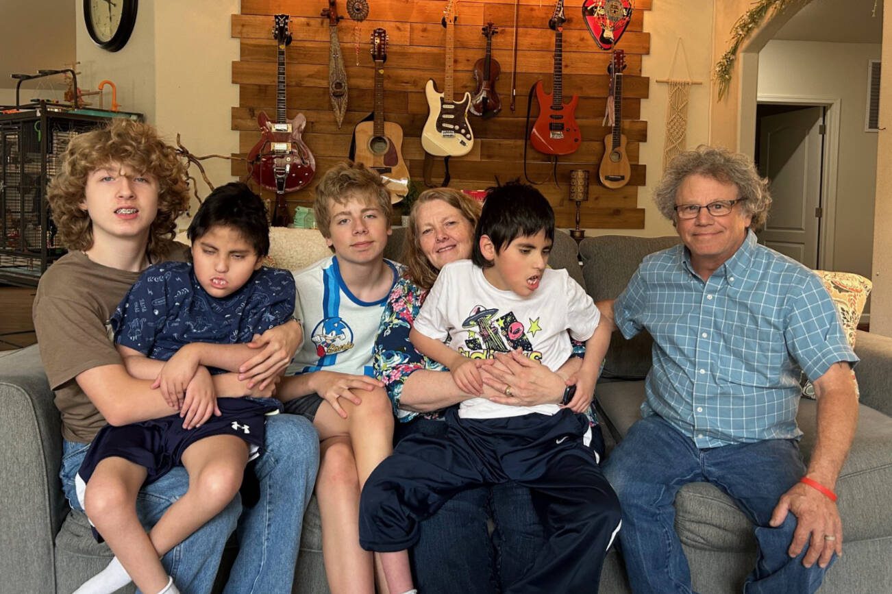 The Alfieris (from left) Jayden, Gabe, Jordan, DeeDee, Jose and Chuck. Over the last 30 years, DeeDee and Chuck have cared for 122 foster children in their Stanwood home, adopting seven of them.