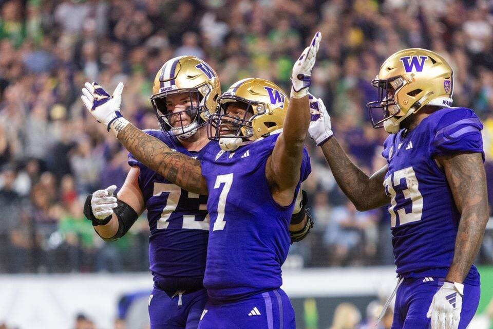 Washington running back Dillon Johnson (#7) waves his arms toward the Oregon crowd after scoring his second rushing touchdown as the No. 3 Huskies face the No. 5 Ducks in the Pac-12 championship game at Allegiant Stadium in Las Vegas on Friday, Dec. 1, 2023.