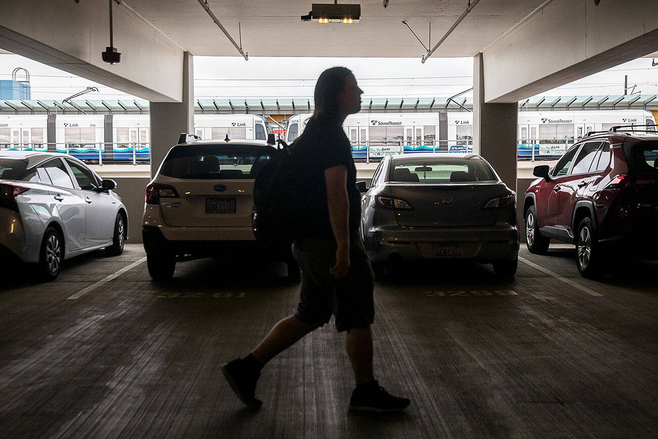 A commuter walks through a packed Lynnwood City Center Station parking garage to the Link train on Tuesday, Sept. 3, 2024 in Lynnwood, Washington. (Olivia Vanni / The Herald)