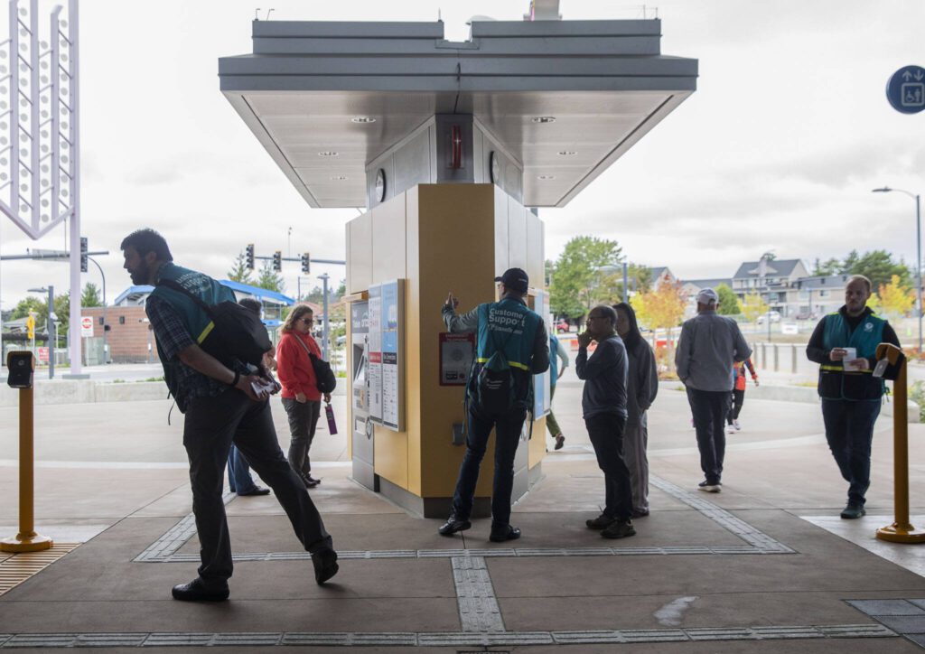 Sound Transit Community Support personnel help riders navigate the new station on Tuesday, Sept. 3, 2024 in Lynnwood, Washington. (Olivia Vanni / The Herald)
