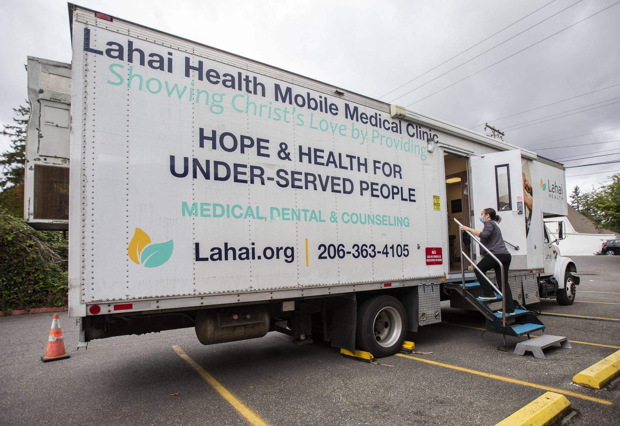 Maggie Konstanski walks onto the Lahai Health Mobile Medical Clinic set up at The Village on Casino Road on Friday, Sept. 20, 2024 in Everett, Washington. (Olivia Vanni / The Herald)