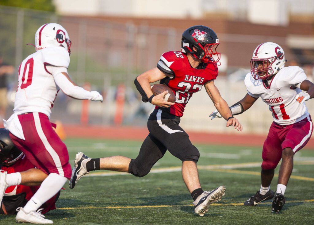 Mountlake Terrace’s Owen Boswell escapes a tackle and runs the ball down the field during the game against Cascade on Friday, Sept. 6, 2024 in Edmonds, Washington. (Olivia Vanni / The Herald)