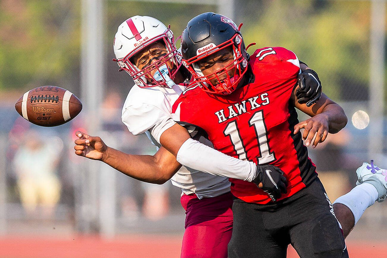 Cascade’s Marcell Alexander strips the ball from Mountlake Terrace’s Mason Wilson during the game on Friday, Sept. 6, 2024 in Edmonds, Washington. (Olivia Vanni / The Herald)