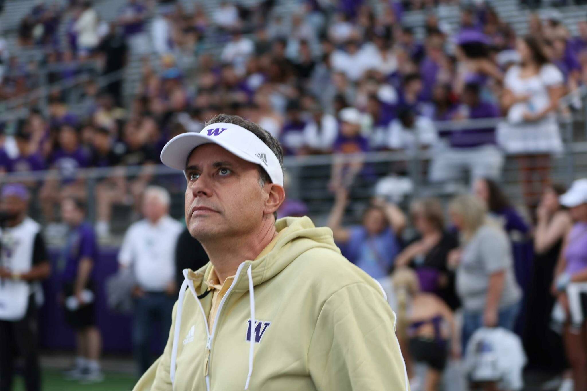 Washington head football coach Jedd Fisch, who will coach in his first Apple Cup on Saturday, looks toward the field in a game against Weber State at Husky Stadium on Saturday, Aug. 31. (Photo courtesy of Scott Eklund / Washington Athletics)