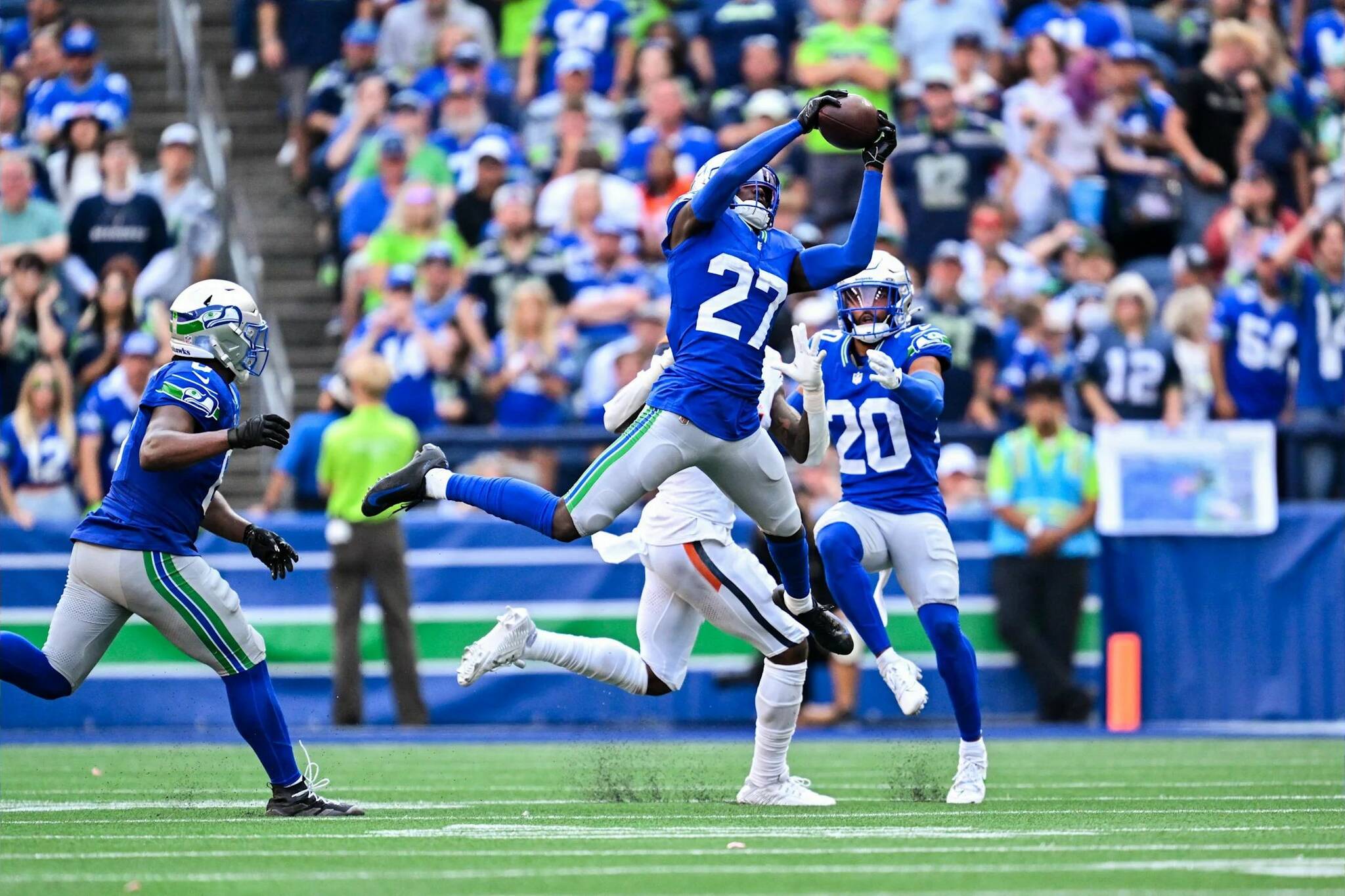 Seattle Seahawks cornerback Riq Woolen intercepts a pass against the Denver Broncos at Lumen Field on Sept. 8, 2024. (Photo courtesy of the Seattle Seahawks)