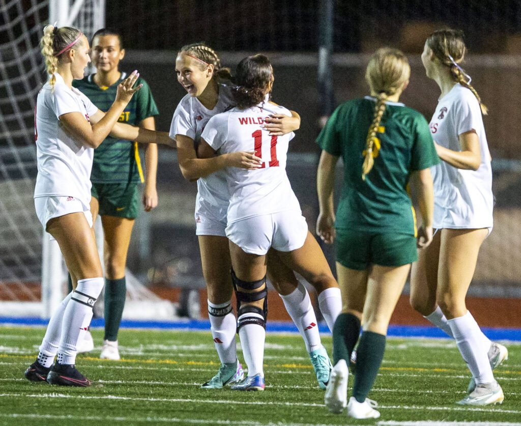 Archbishop Murphy’s Chloe McCoy is hugged by teammate Ari Sullivan after scoring a goal during the game against Shorecrest on Tuesday, Sept. 17, 2024 in Shoreline, Washington. (Olivia Vanni / The Herald)
