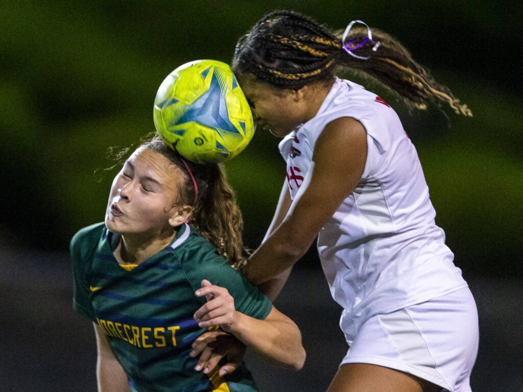 Shorecrest’s Olivia Taylor and Archbishop Murphy’s Kayla Hookfin leap in the air to head the ball during the game on Tuesday, Sept. 17, 2024 in Shoreline, Washington. (Olivia Vanni / The Herald)
