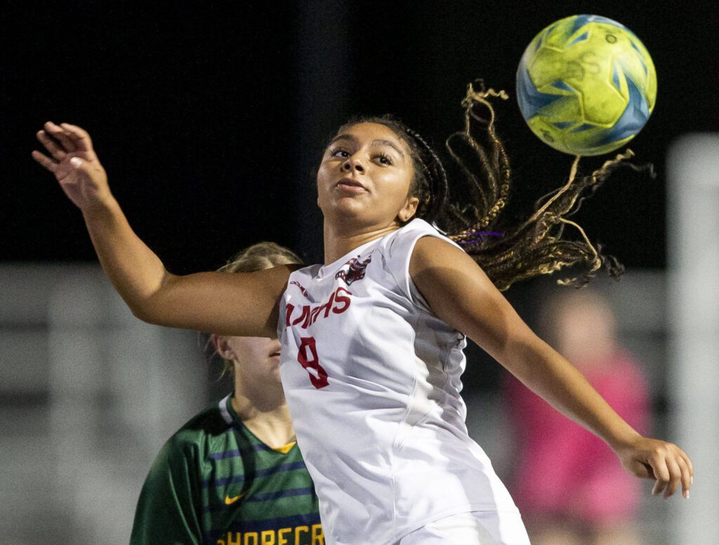 Archbishop Murphy’s Kayla Hookfin head the ball during the game against Shorecrest on Tuesday, Sept. 17, 2024 in Shoreline, Washington. (Olivia Vanni / The Herald)
