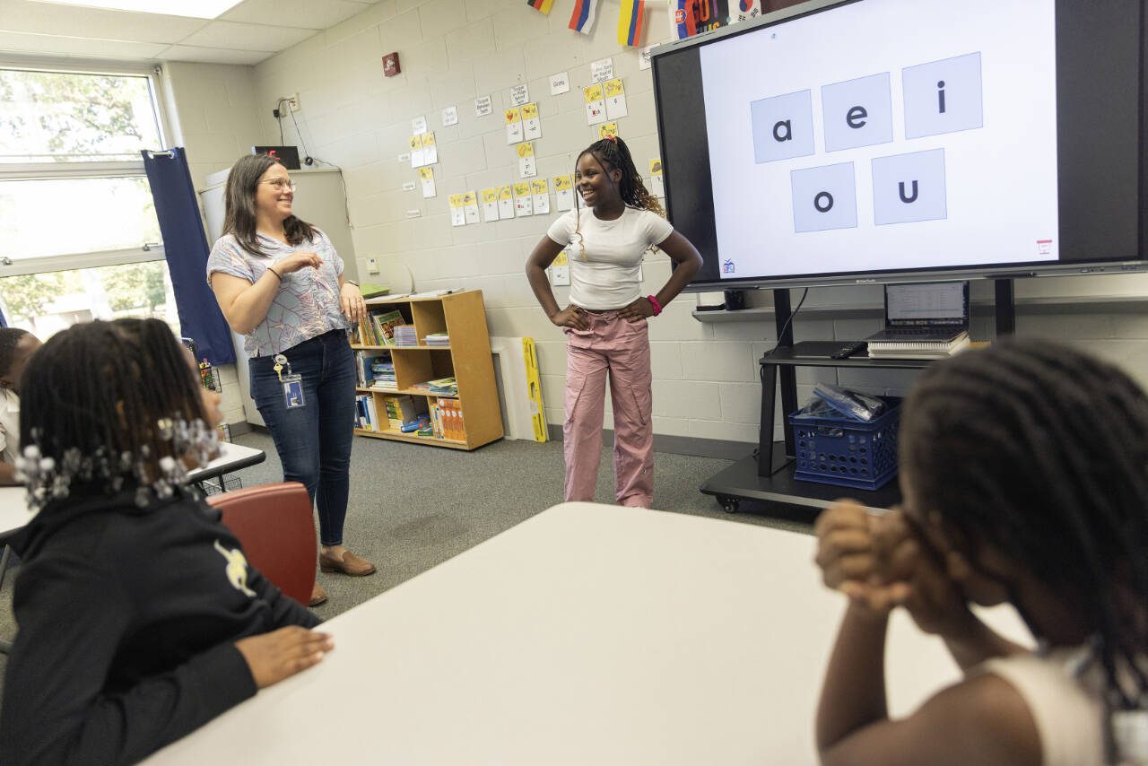 Students attend an English-language-learners class at Fulton Elementary School in Springfield, Ohio on Aug. 27. Businesses needed workers, and Haitians, many already authorized to work, heard living costs were low in Springfield. But the newcomers have strained resources, and that has fueled tension, now further complicated by false accusations against the Haitian community. (Maddie McGarvey / The New York Times)