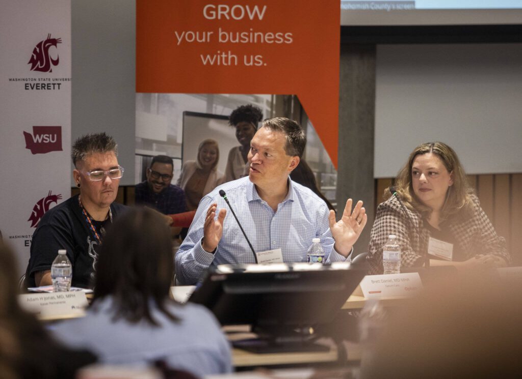Dr. Brett Daniel, chief medical informatics officer for Optum, speaks at the the Healthcare Summit at WSU Everett on Tuesday, Sept. 24, 2024 in Everett, Washington. (Olivia Vanni / The Herald)
