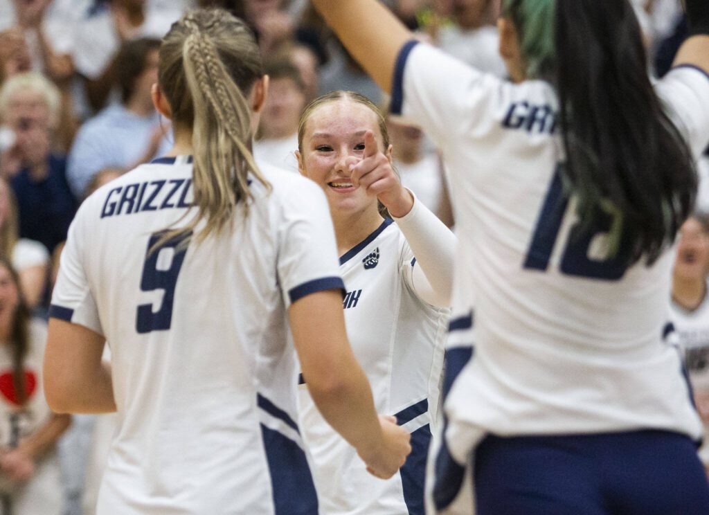 Glacier Peak’s Ava Nowak points to teammate Lucy Cornelius for setting her up for the point during the game against Jackson on Wednesday, Sept. 25, 2024 in Snohomish, Washington. (Olivia Vanni / The Herald)
