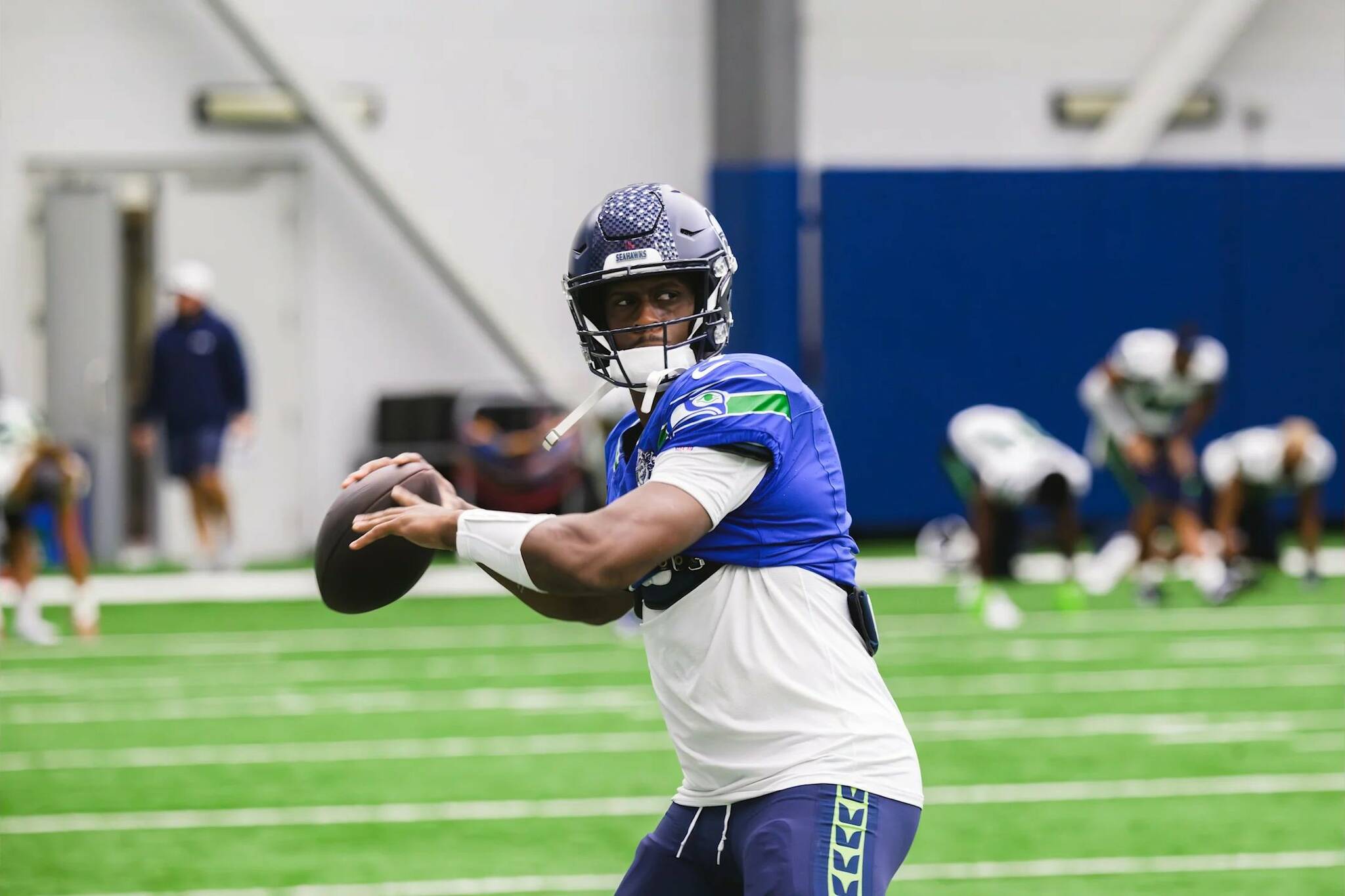 Seahawks quarterback Geno Smith throws a pass during indoor practice on Wednesday, Sept. 25 at the Virginia Mason Athletic Center in Renton. (Photo courtesy of Edwin Hooper / Seattle Seahawks)