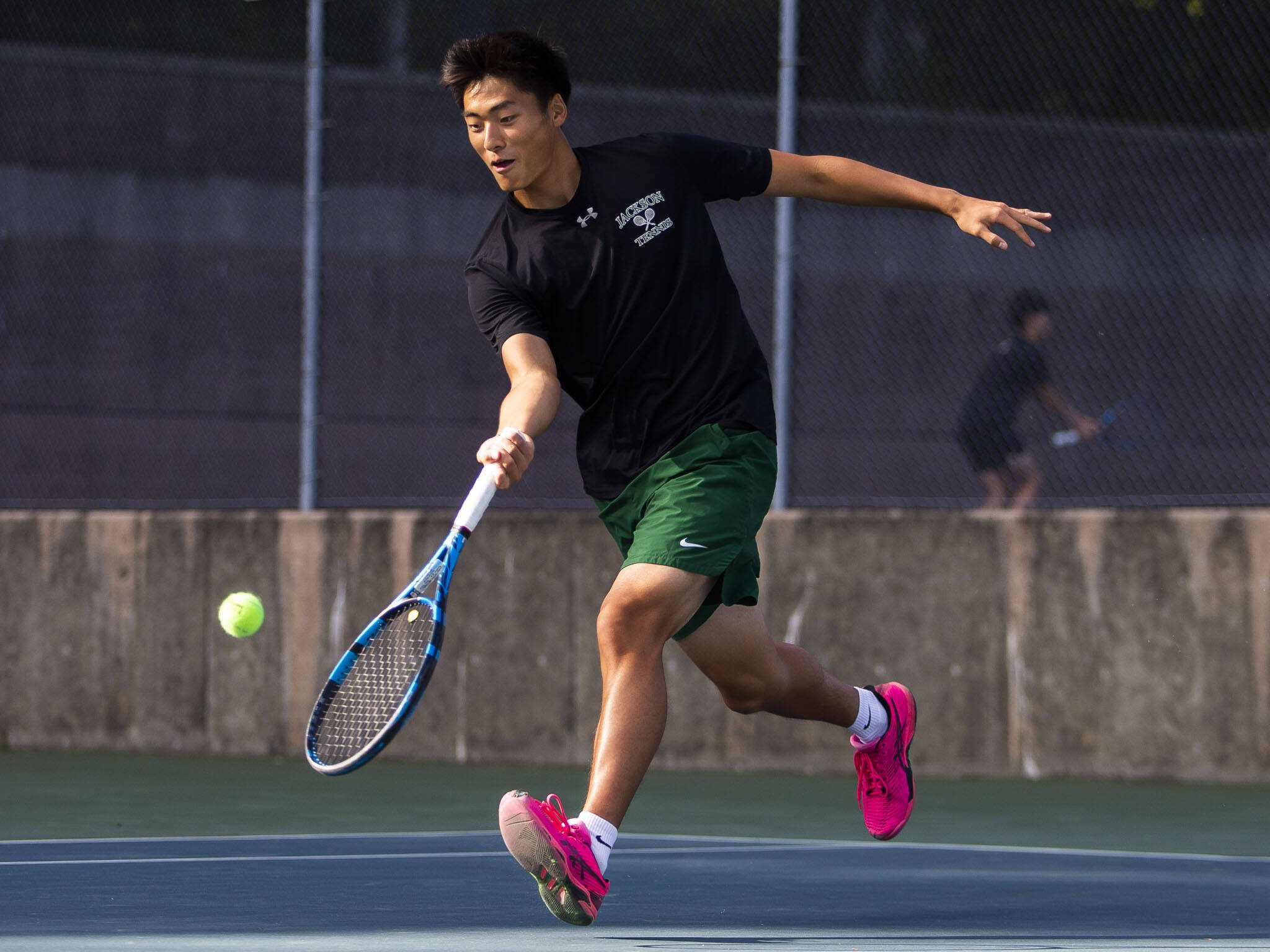 Jackson’s Ben Lee scrambles after the ball during a doubles match again Kamiak on Monday, Sept. 30, 2024 in Mill Creek, Washington. (Olivia Vanni / The Herald)