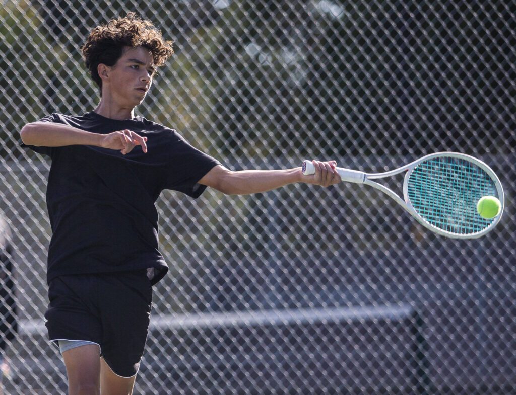 Kamiak’s Levi Seslar hits the ball during a double match against Jackson on Monday, Sept. 30, 2024 in Mill Creek, Washington. (Olivia Vanni / The Herald)

