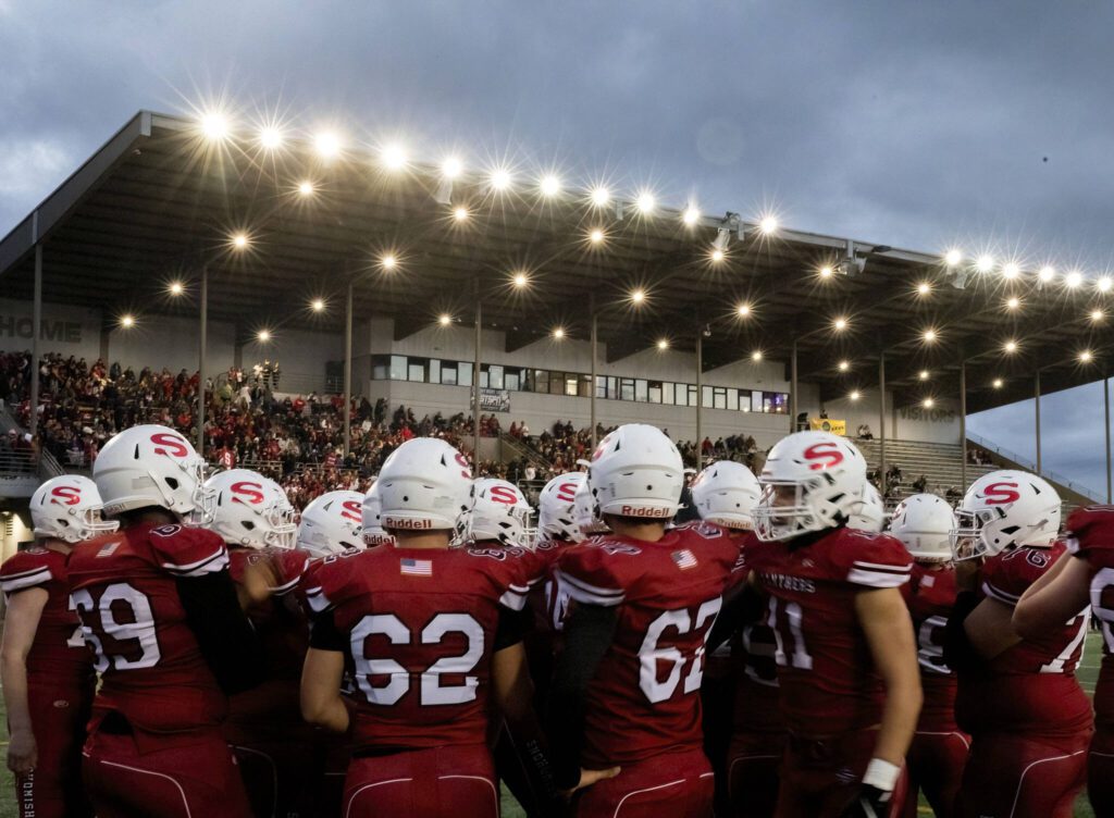 Snohomish players gather for a pep talk before the start of the game on Friday, Oct. 4, 2024 in Snohomish, Washington. (Olivia Vanni / The Herald)

