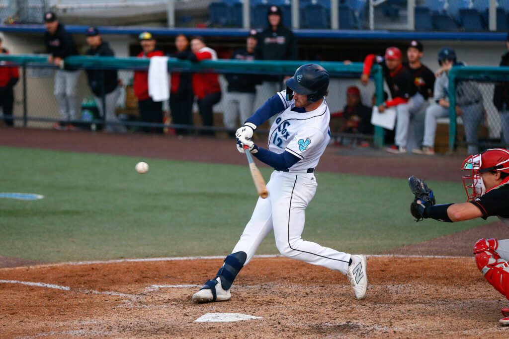 Aquasox outfielder RJ Schreck hits the ball during a game against the Vancouver Giants on Wednesday, June 5, 2024, at Funko Field in Everett, Washington. (Ryan Berry / The Herald)
