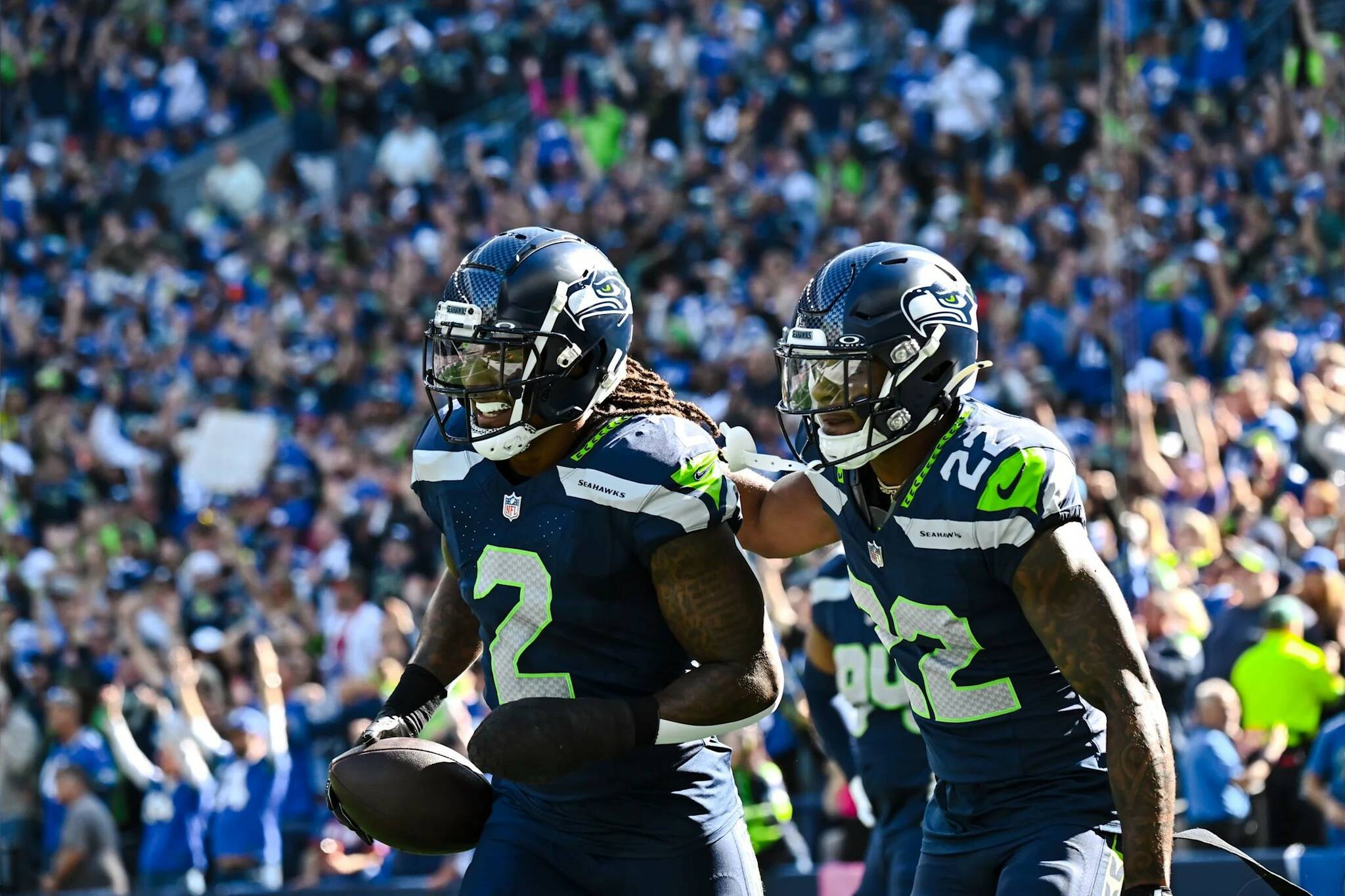 Seahawks safety Rayshawn Jenkins (2) celebrates with teammate Tre Brown (22) after returning a fumble 102 yards for a touchdown against the New York Giants on Oct. 6, 2024 at Lumen Field in Seattle. (Photo courtesy of the Seattle Seahawks)