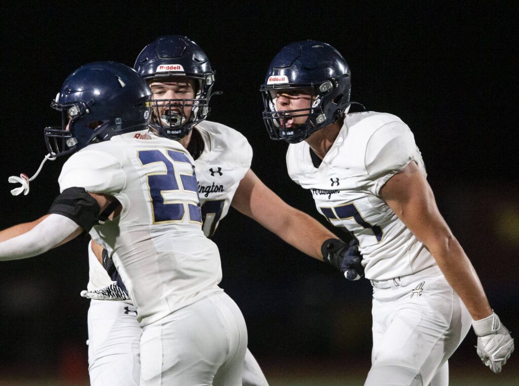 Arlington’s Levi Reid reacts to his tackle during the Stilly Cup game against Stanwood on Friday, Oct. 11, 2024 in Stanwood, Washington. (Olivia Vanni / The Herald)
