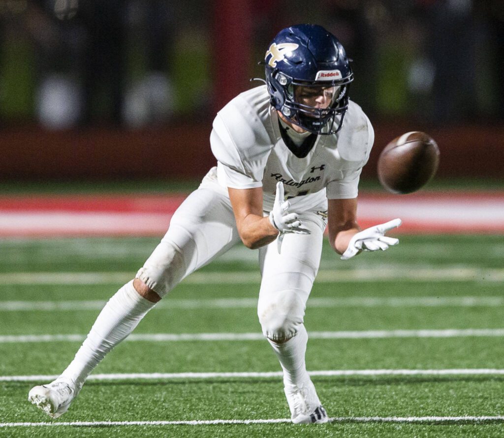 Arlington’s Jake Willis makes a catch during the Stilly Cup game against Stanwood on Friday, Oct. 11, 2024 in Stanwood, Washington. (Olivia Vanni / The Herald)
