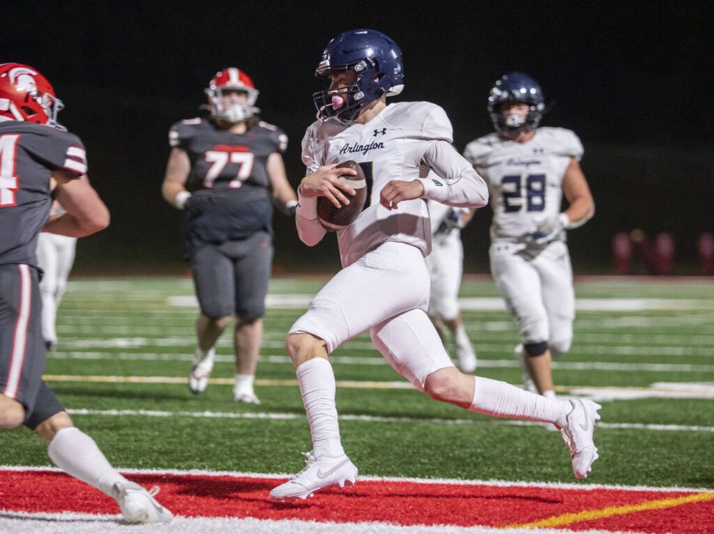 Arlington’s Leyton Martin runs into the end zone for a touchdown during the Stilly Cup game against Stanwood on Friday, Oct. 11, 2024 in Stanwood, Washington. (Olivia Vanni / The Herald)
