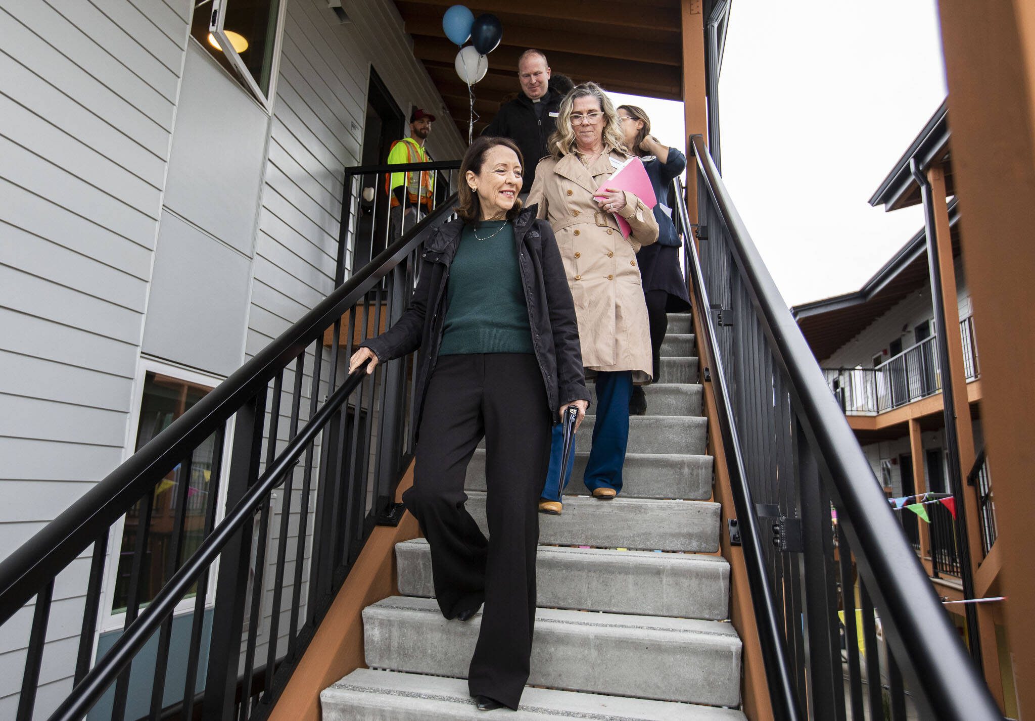 U.S. Sen. Maria Cantwell goes on a tour with Housing Hope CEO Donna Moulton and Edmonds Lutheran Pastor Tim Oleson of the new Madrona Highlands housing complex on Tuesday, Oct. 15, 2024 in Edmonds, Washington. (Olivia Vanni / The Herald)
