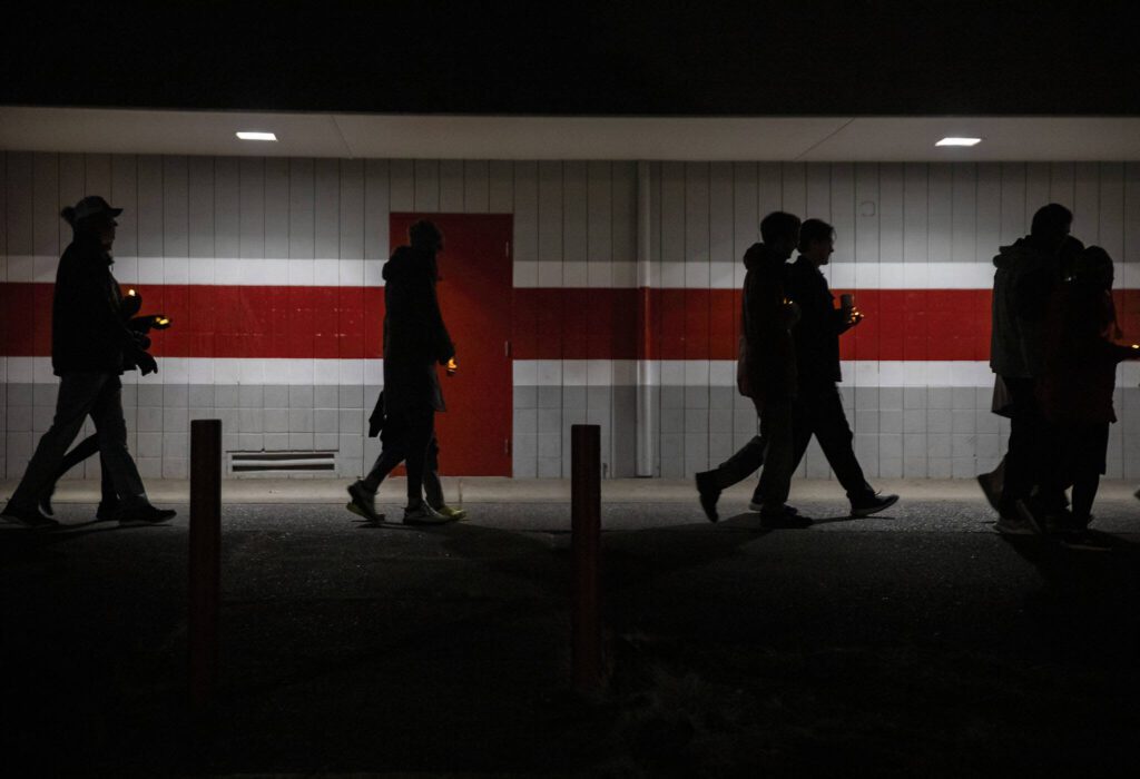 Community members join in a memorial walk on the 10-year anniversary of the shooting at Marysville Pilchuck High School to honor those that died on Thursday, Oct. 24, 2024 in Marysville, Washington. (Olivia Vanni / The Herald)
