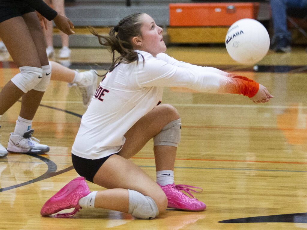Monroe’s Maddie Walker digs the ball during the game against Snohomish on Wednesday, Oct. 16, 2024 in Monroe, Washington. (Olivia Vanni / The Herald)
