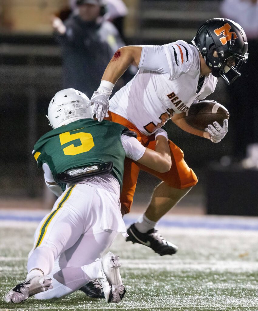Monroe’s Aaron Clifton runs through a tackle during the game against Shorecrest on Friday, Oct. 18, 2024 in Shoreline, Washington. (Olivia Vanni / The Herald)
