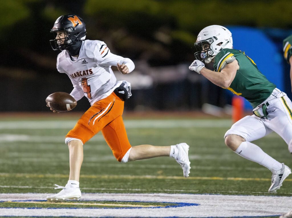 Monroe’s Logan Manson scrambles away from a Shorecrest player during the game on Friday, Oct. 18, 2024 in Shoreline, Washington. (Olivia Vanni / The Herald)
