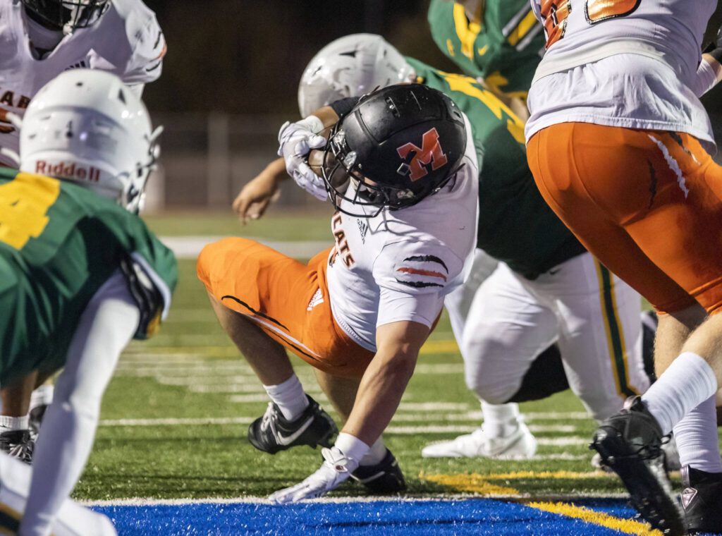 Monroe’s Aaron Clifton falls into the end zone for a touchdown during the game against Shorecrest on Friday, Oct. 18, 2024 in Shoreline, Washington. (Olivia Vanni / The Herald)

